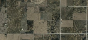 The agricultural landscape south of Clear Lake, Iowa. The light-colored patches in plowed fields are areas where dark-colored, organic-rich topsoil has been lost to erosion. Image courtesy GoogleEarth.